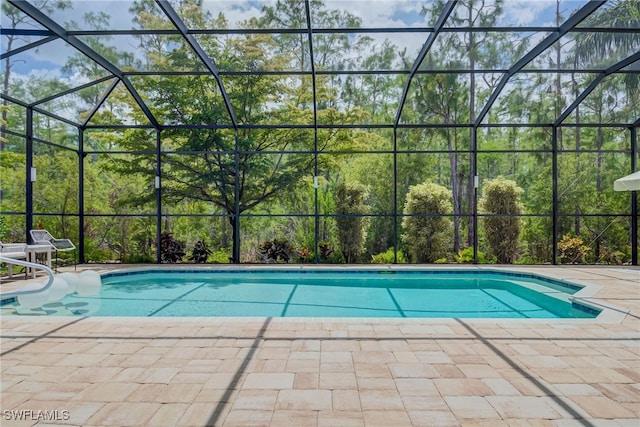 outdoor pool with a patio area