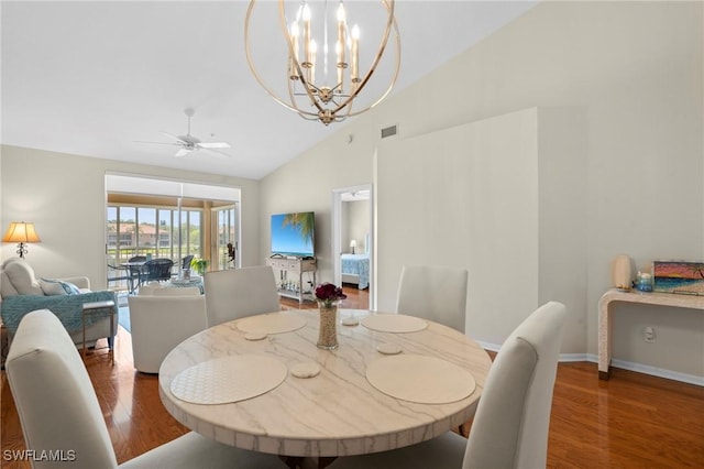 6660 Huntington Lakes Cir Unit 204, Naples, FL 34119 - dining space with high vaulted ceiling, ceiling fan with notable chandelier, baseboards, wood finished floors, and visible vents