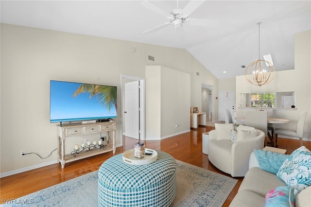 6660 Huntington Lakes Cir Unit 204, Naples, FL 34119 - living room with visible vents, baseboards, ceiling fan with notable chandelier, and wood finished floors