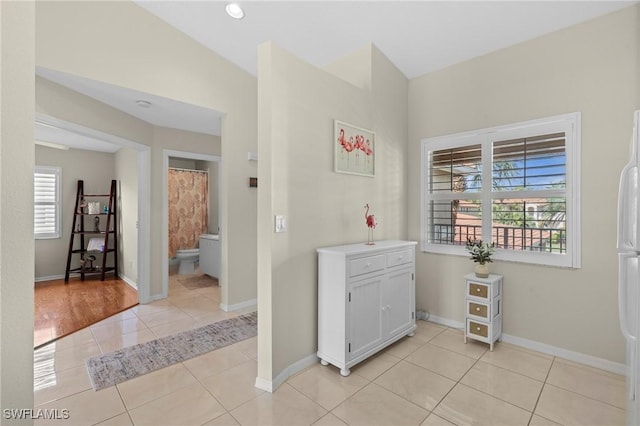 6660 Huntington Lakes Cir Unit 204, Naples, FL 34119 - interior space featuring light tile patterned flooring and baseboards