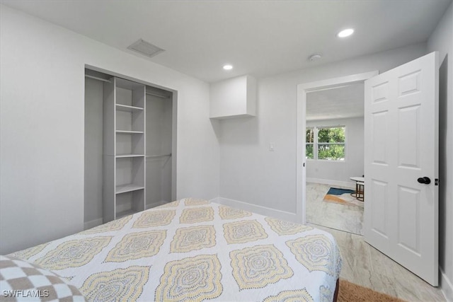 1115 Central Dr, Naples, FL 34104 - bedroom featuring light wood-style flooring, recessed lighting, baseboards, visible vents, and a closet