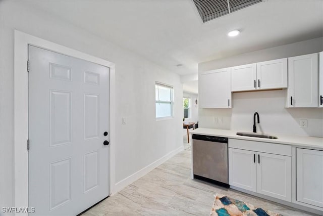 1115 Central Dr, Naples, FL 34104 - kitchen with visible vents, stainless steel dishwasher, a sink, baseboards, and light countertops