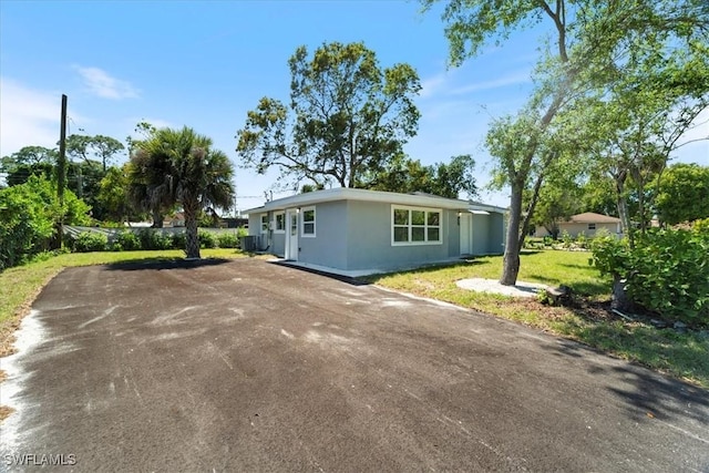 1115 Central Dr, Naples, FL 34104 - view of front of house with driveway and stucco siding