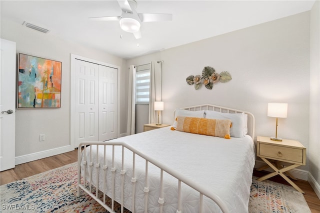 3565 Balboa Cir W, Naples, FL 34105 - bedroom featuring a closet, visible vents, wood finished floors, and baseboards