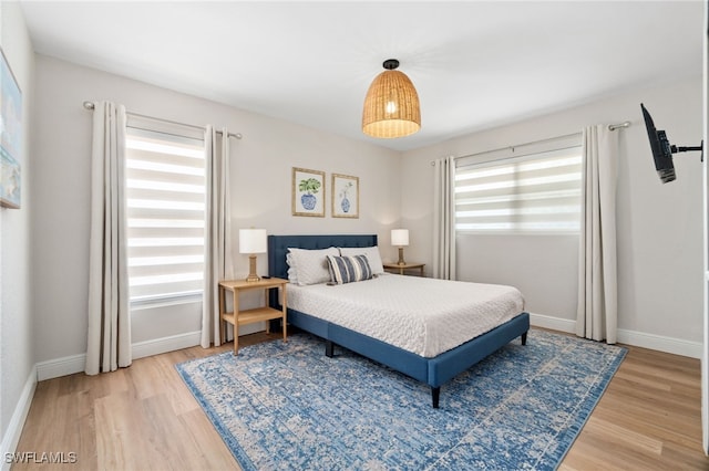 3565 Balboa Cir W, Naples, FL 34105 - bedroom with baseboards and light wood-type flooring