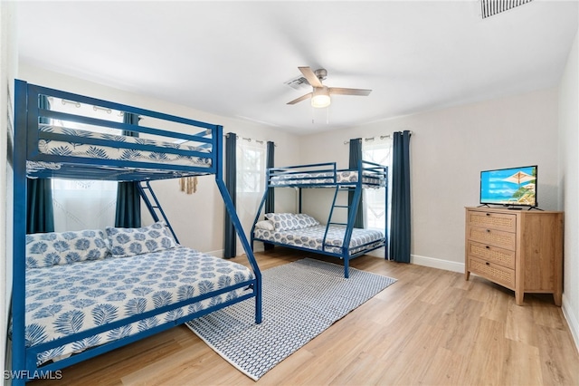 3565 Balboa Cir W, Naples, FL 34105 - bedroom with visible vents, ceiling fan, light wood-style floors, and baseboards