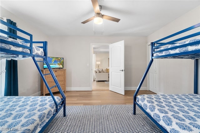 3565 Balboa Cir W, Naples, FL 34105 - bedroom with a closet, a ceiling fan, baseboards, and light wood-style floors