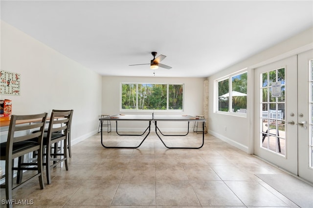 3565 Balboa Cir W, Naples, FL 34105 - dining area with light tile patterned floors, ceiling fan, and baseboards