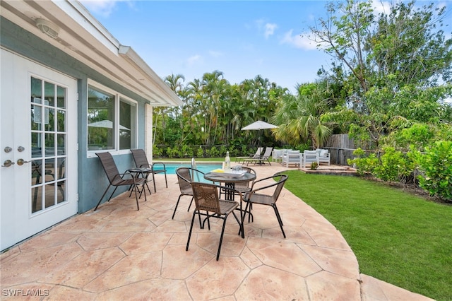 3565 Balboa Cir W, Naples, FL 34105 - view of patio / terrace featuring a fenced in pool and a fenced backyard