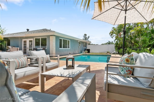 3565 Balboa Cir W, Naples, FL 34105 - view of pool with an outdoor living space, a fenced in pool, french doors, and a patio area
