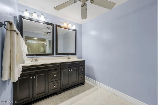 full bathroom with a ceiling fan, baseboards, a sink, and tile patterned flooring