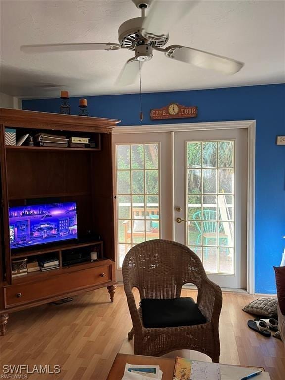 2385 Naples Trace Cir Unit 1, Naples, FL 34109 - living room with plenty of natural light, ceiling fan, and wood finished floors