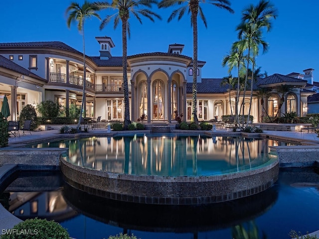 9663 Mashie Ct, Naples, FL 34108 - view of swimming pool featuring a pool with connected hot tub and a patio