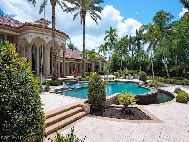 9663 Mashie Ct, Naples, FL 34108 - view of swimming pool featuring an infinity pool and a patio
