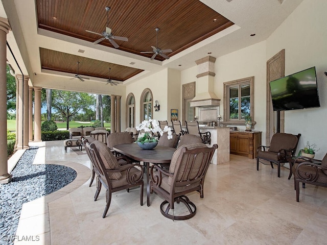 9663 Mashie Ct, Naples, FL 34108 - view of patio / terrace featuring outdoor dining area, a ceiling fan, and exterior kitchen