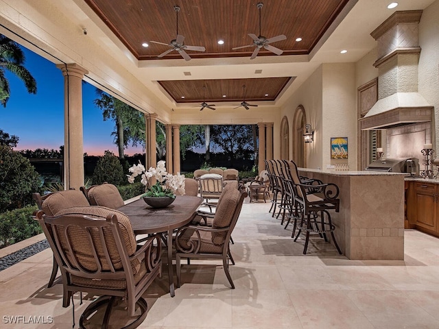 9663 Mashie Ct, Naples, FL 34108 - view of patio / terrace with an outdoor kitchen, ceiling fan, and outdoor dining space