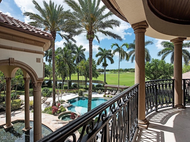 9663 Mashie Ct, Naples, FL 34108 - balcony with view of pool area, a pool with connected hot tub, and view of golf course