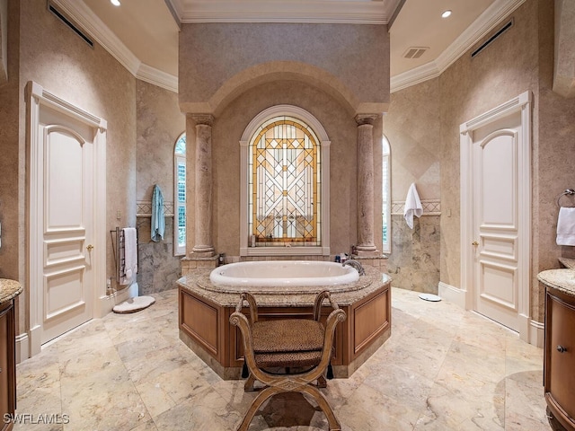 9663 Mashie Ct, Naples, FL 34108 - bathroom with a bath, ornate columns, ornamental molding, vanity, and stone tile floors