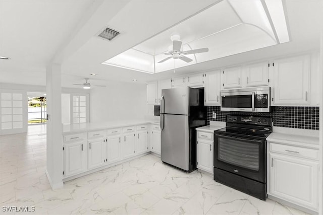 kitchen with marble finish floor, ceiling fan, stainless steel appliances, and light countertops
