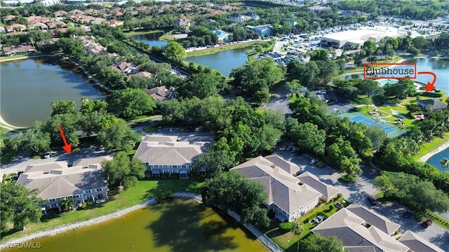 birds eye view of property with a residential view and a water view