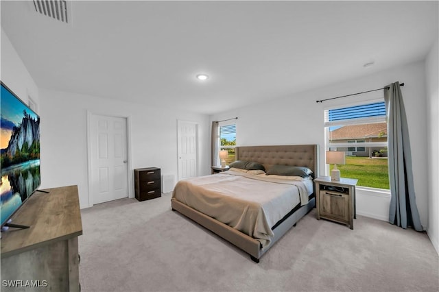bedroom featuring visible vents, recessed lighting, and carpet floors