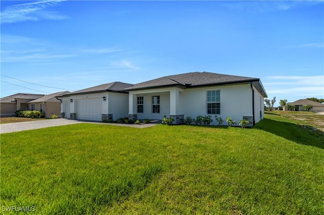 prairie-style house featuring driveway, a front lawn, stucco siding, and an attached garage