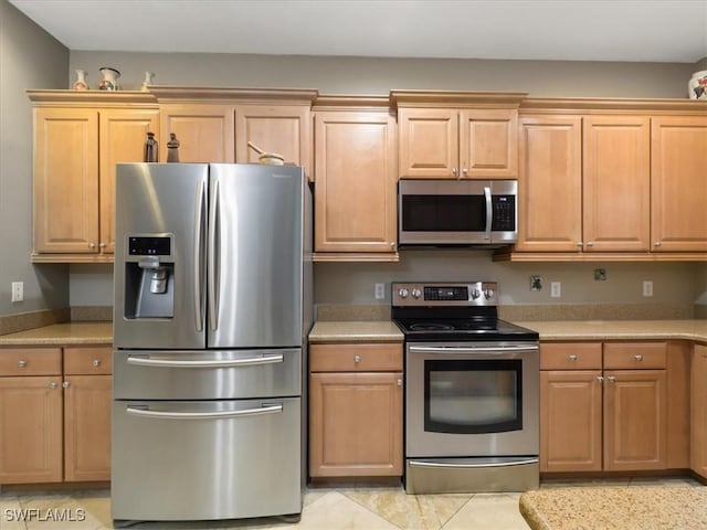 4371 Lazio Way Unit 707, Fort Myers, FL 33901 - kitchen featuring appliances with stainless steel finishes and light countertops