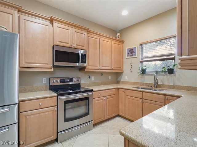 4371 Lazio Way Unit 707, Fort Myers, FL 33901 - kitchen featuring recessed lighting, light brown cabinets, appliances with stainless steel finishes, and a sink