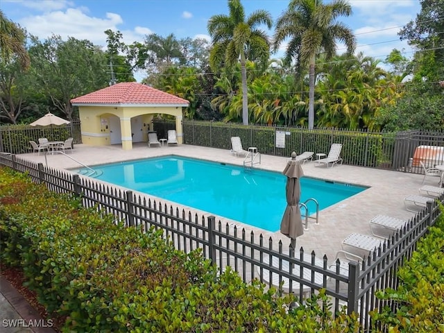 4371 Lazio Way Unit 707, Fort Myers, FL 33901 - community pool featuring fence and a patio