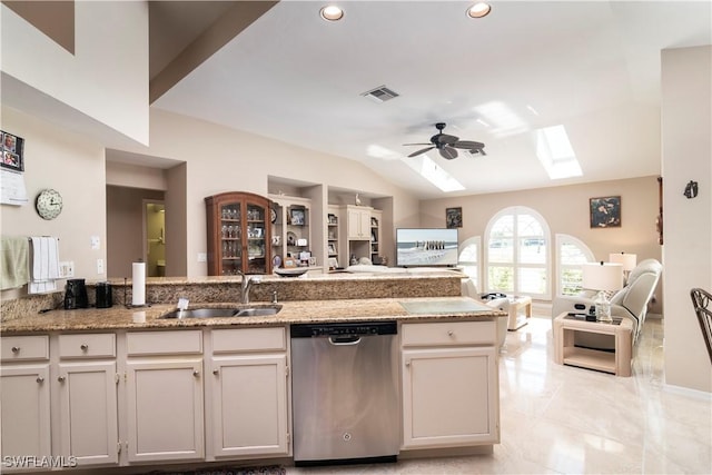 9895 El Greco Cir, Bonita Springs, FL 34135 - kitchen featuring dishwasher, open floor plan, a sink, a skylight, and a ceiling fan