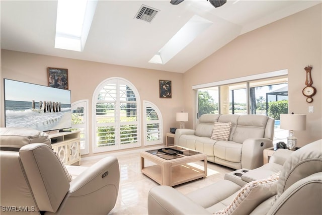 9895 El Greco Cir, Bonita Springs, FL 34135 - living area featuring a skylight, vaulted ceiling, and healthy amount of natural light
