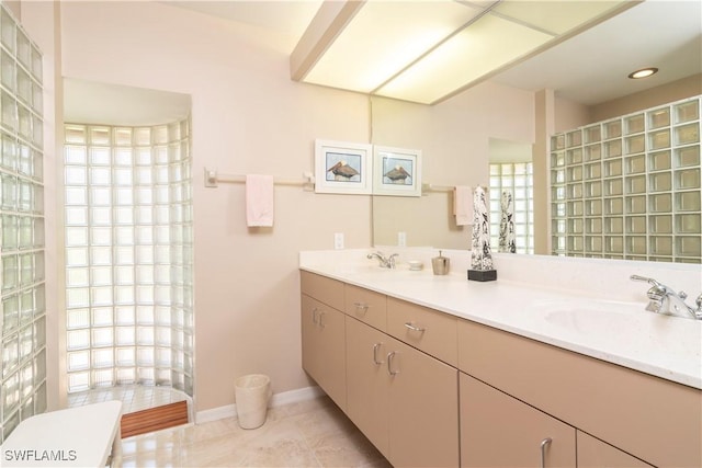 9895 El Greco Cir, Bonita Springs, FL 34135 - bathroom featuring tile patterned floors, walk in shower, double vanity, and baseboards