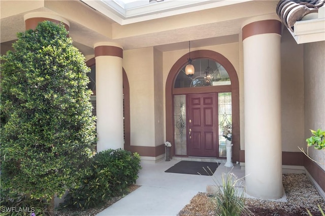 9895 El Greco Cir, Bonita Springs, FL 34135 - view of exterior entry featuring stucco siding