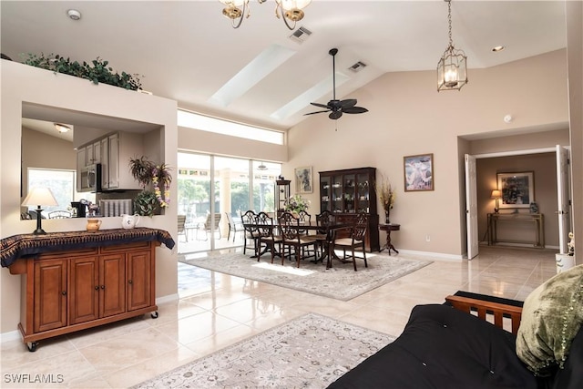 9895 El Greco Cir, Bonita Springs, FL 34135 - living area with light tile patterned flooring, a chandelier, baseboards, a ceiling fan, and high vaulted ceiling