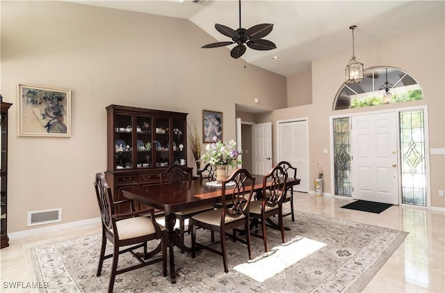 9895 El Greco Cir, Bonita Springs, FL 34135 - dining room featuring high vaulted ceiling, ceiling fan, and baseboards