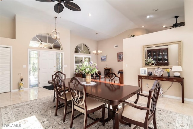 9895 El Greco Cir, Bonita Springs, FL 34135 - dining room with a ceiling fan, a chandelier, baseboards, light tile patterned floors, and high vaulted ceiling