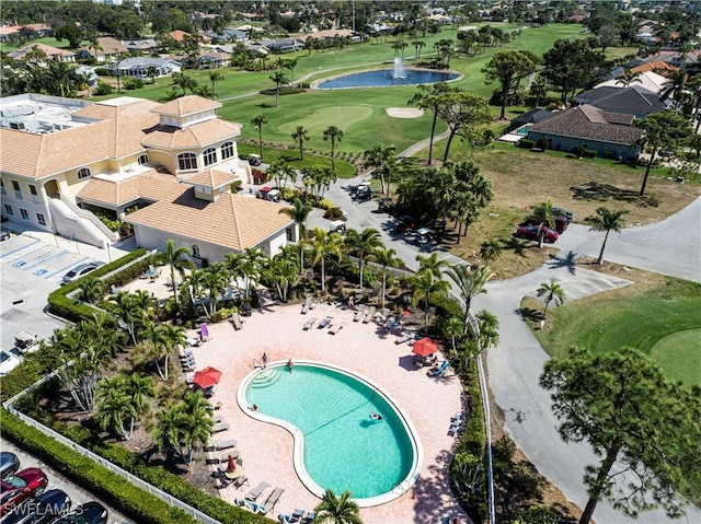 9895 El Greco Cir, Bonita Springs, FL 34135 - drone / aerial view of a nearby body of water, a golf course, and a pool area