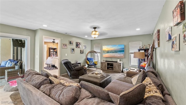 living room with recessed lighting and a ceiling fan