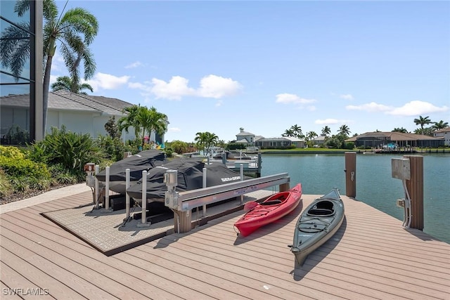 dock area with a water view and a residential view