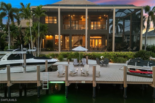 view of back of property at dusk