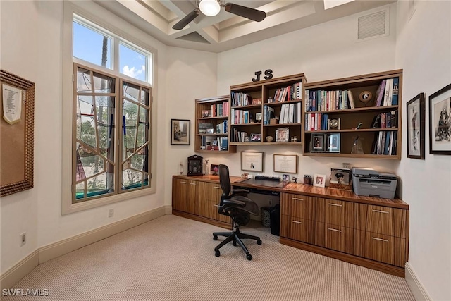 office area with a ceiling fan, visible vents, baseboards, light carpet, and coffered ceiling