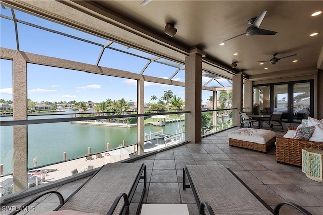 130 Hollyhock Ct, Marco Island, FL 34145 - sunroom with a water view and recessed lighting
