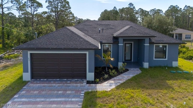 view of front of property featuring a garage, a shingled roof, a front lawn, and stucco siding