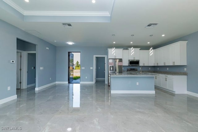 kitchen featuring appliances with stainless steel finishes, ornamental molding, a raised ceiling, and visible vents