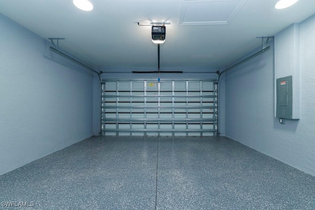 garage with a garage door opener and electric panel