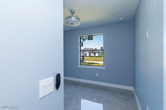 empty room with baseboards
