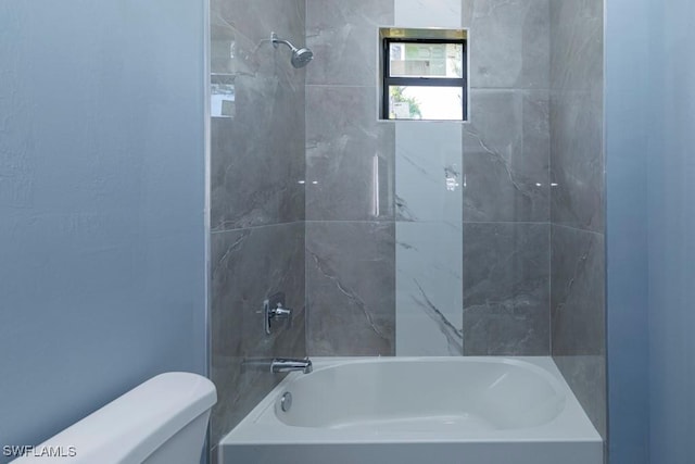 full bathroom featuring bathing tub / shower combination and toilet