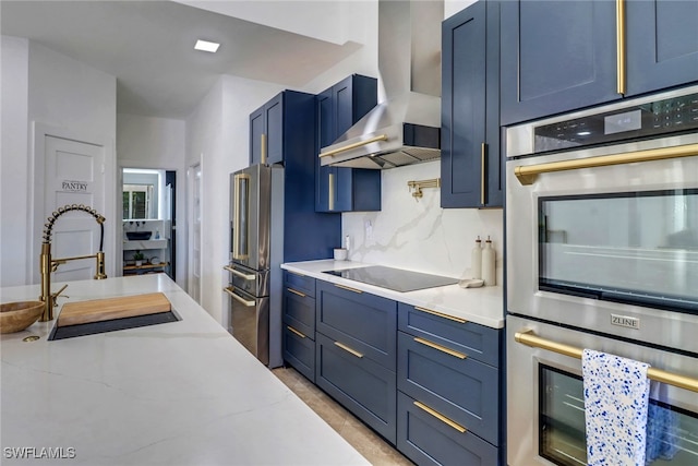9680 Pineapple Preserve Ct, Fort Myers, FL 33908 - kitchen featuring light stone counters, a sink, blue cabinetry, wall chimney exhaust hood, and stainless steel appliances