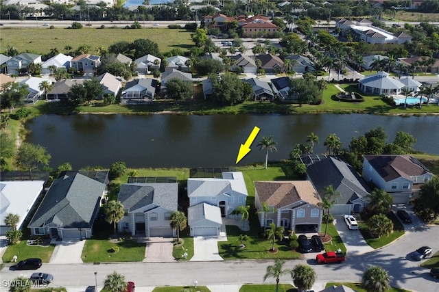 9680 Pineapple Preserve Ct, Fort Myers, FL 33908 - drone / aerial view with a residential view and a water view