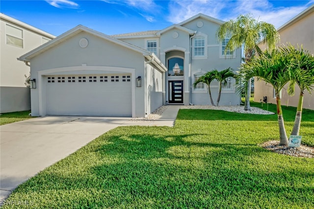 9680 Pineapple Preserve Ct, Fort Myers, FL 33908 - view of front facade featuring a garage, stucco siding, driveway, and a front lawn